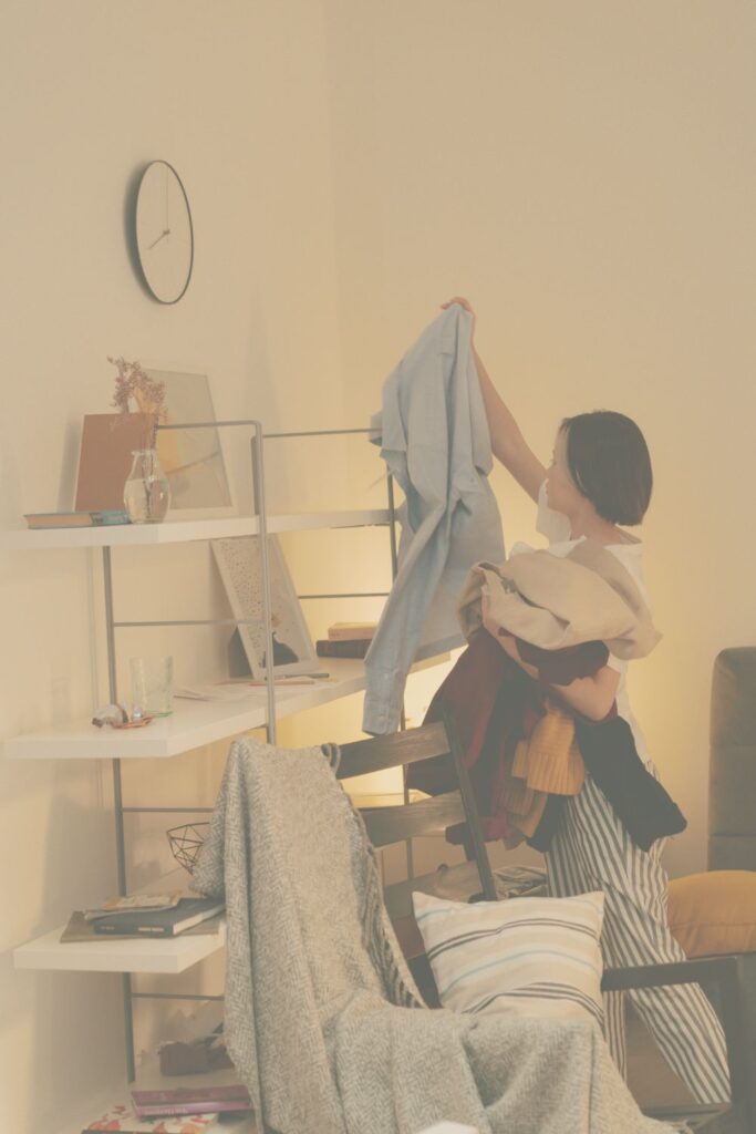 woman tidies the house